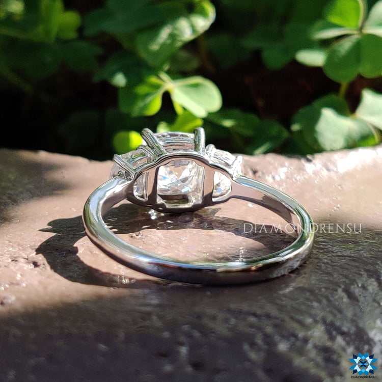 Handmade three stone engagement ring in white gold.
