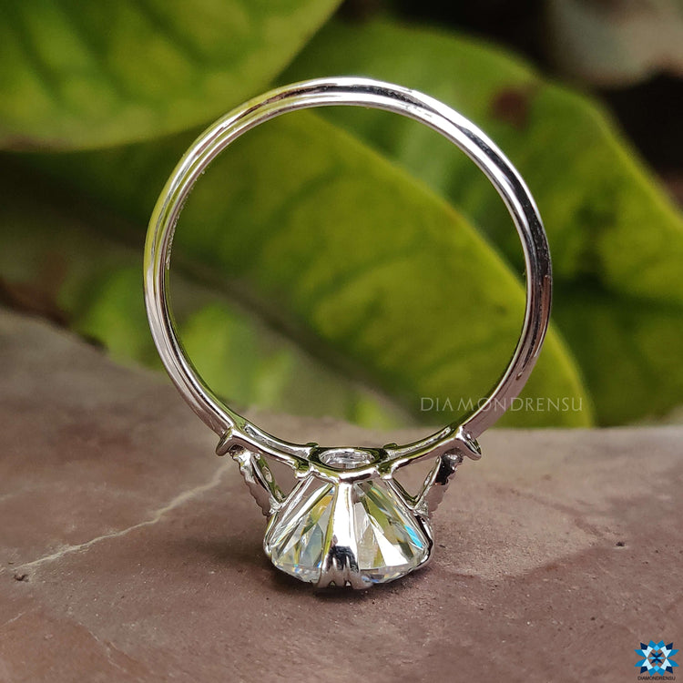 Handmade moissanite ring with cushion and old European cuts.
