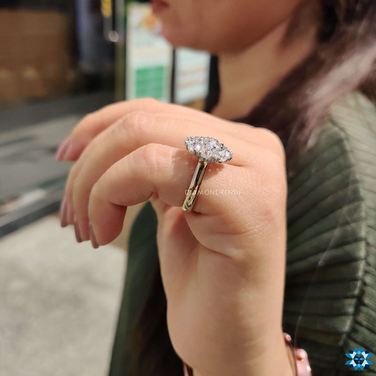 Handmade moissanite ring with a classic cathedral setting.
