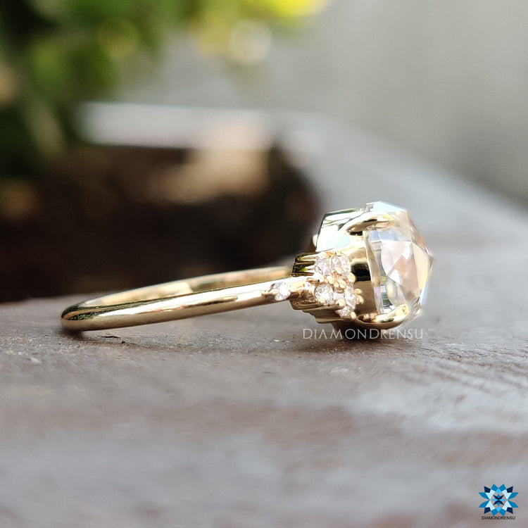 Moissanite ring UK with handmade muse setting and claw prong detail.
