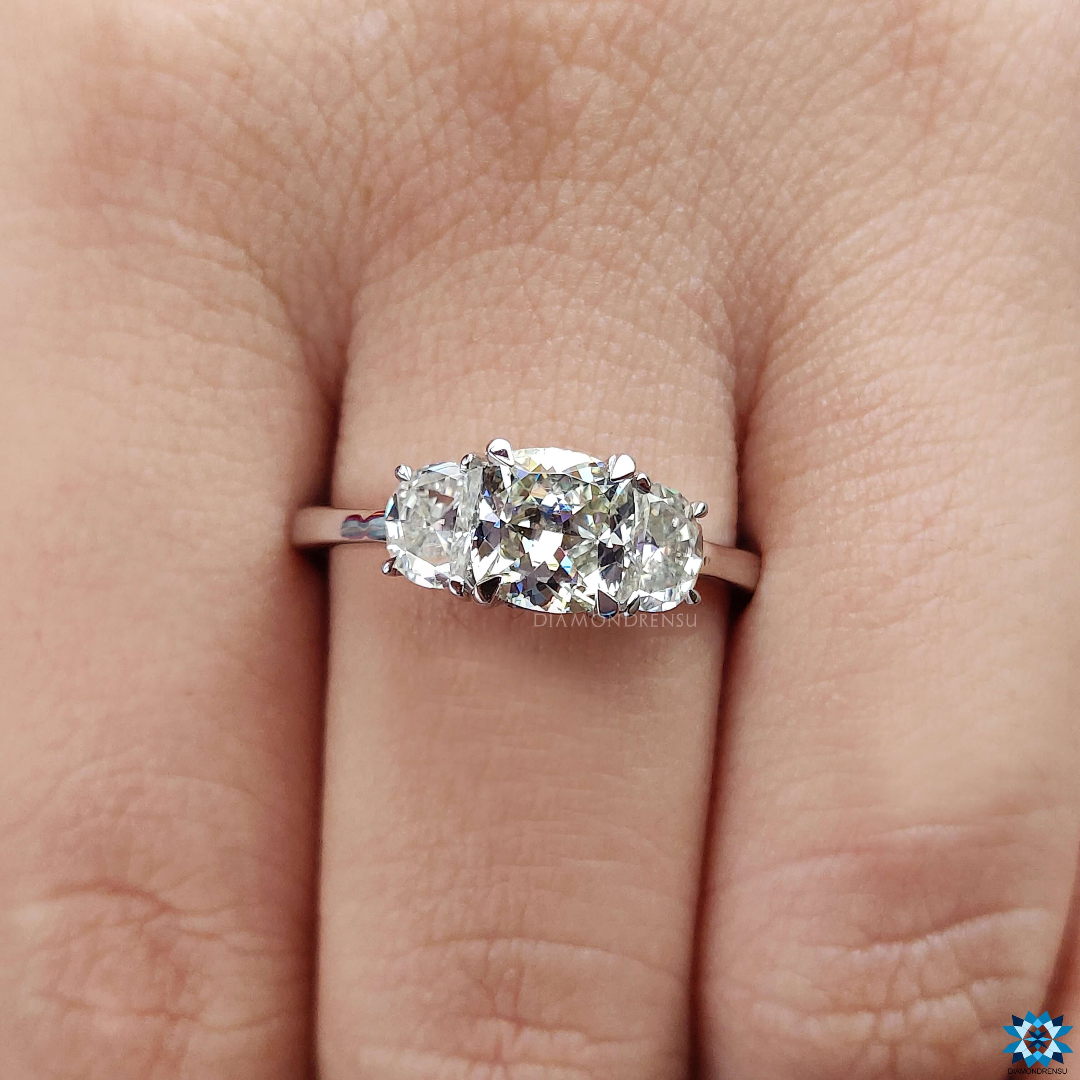 Elegant half moon ring design paired with a stunning cushion cut ring.