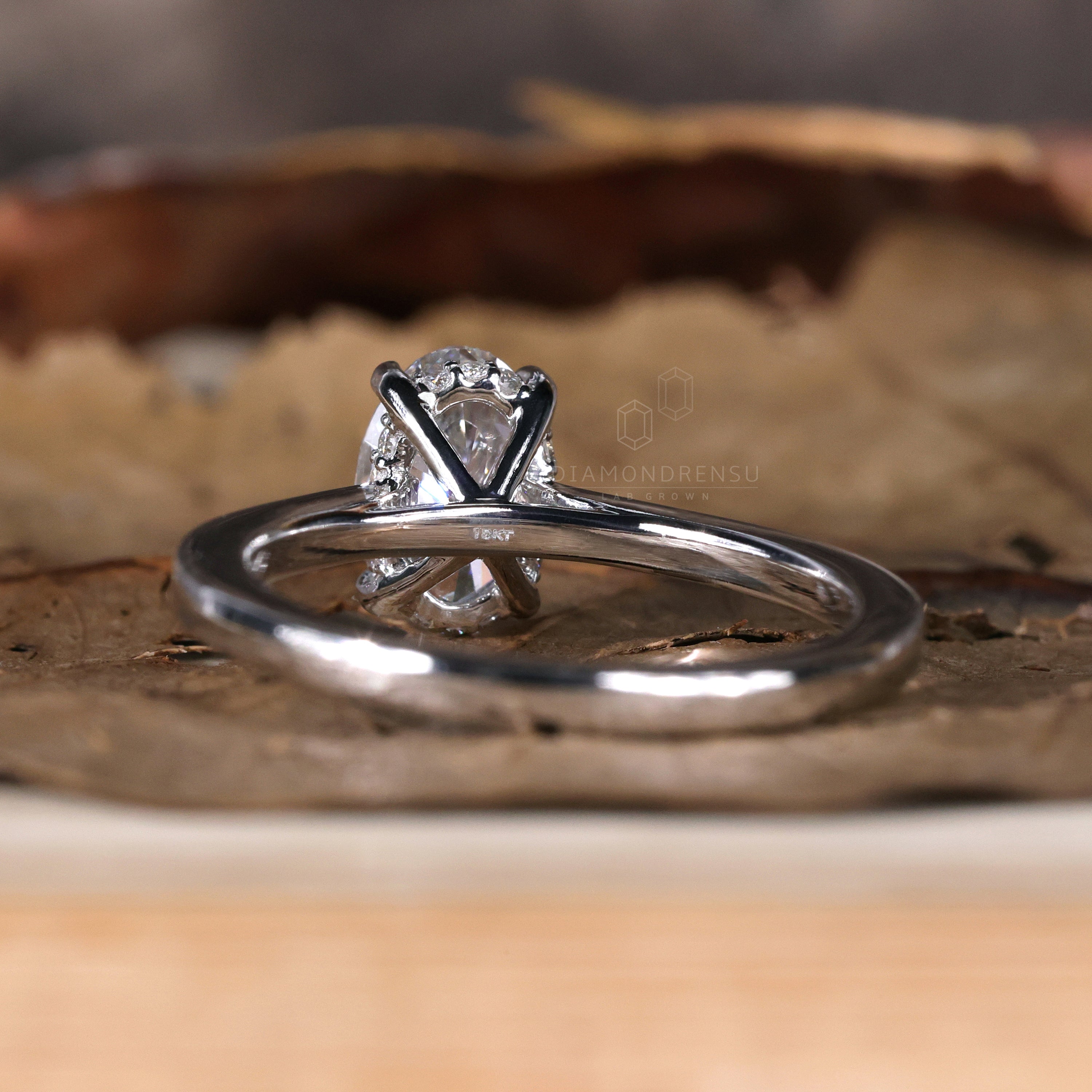 Oval diamond ring featuring a handmade design.