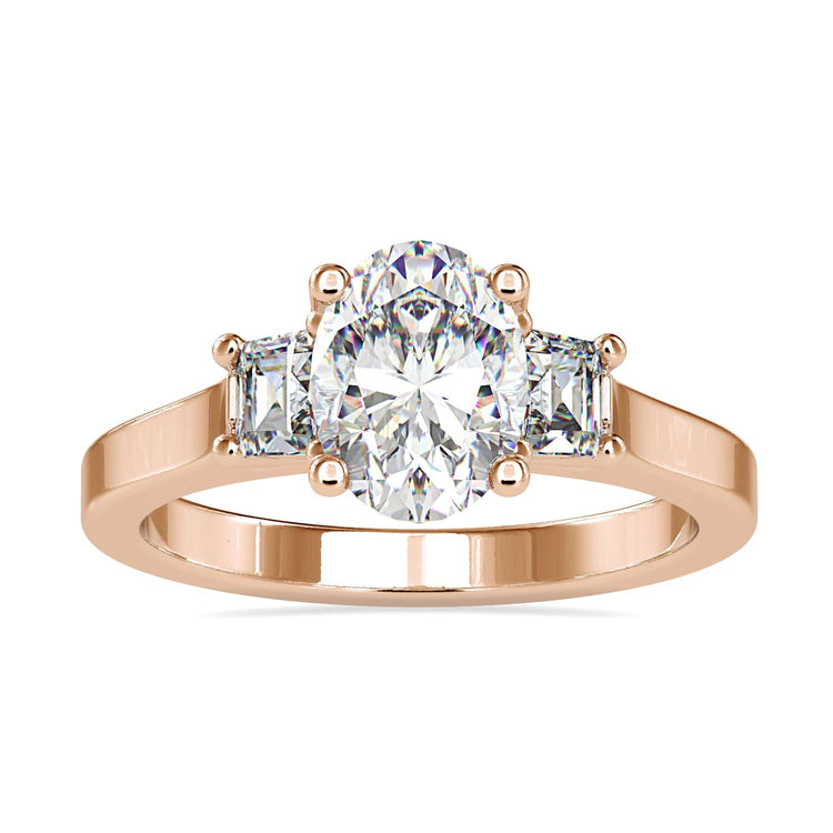 White gold engagement ring with three stone oval design.
