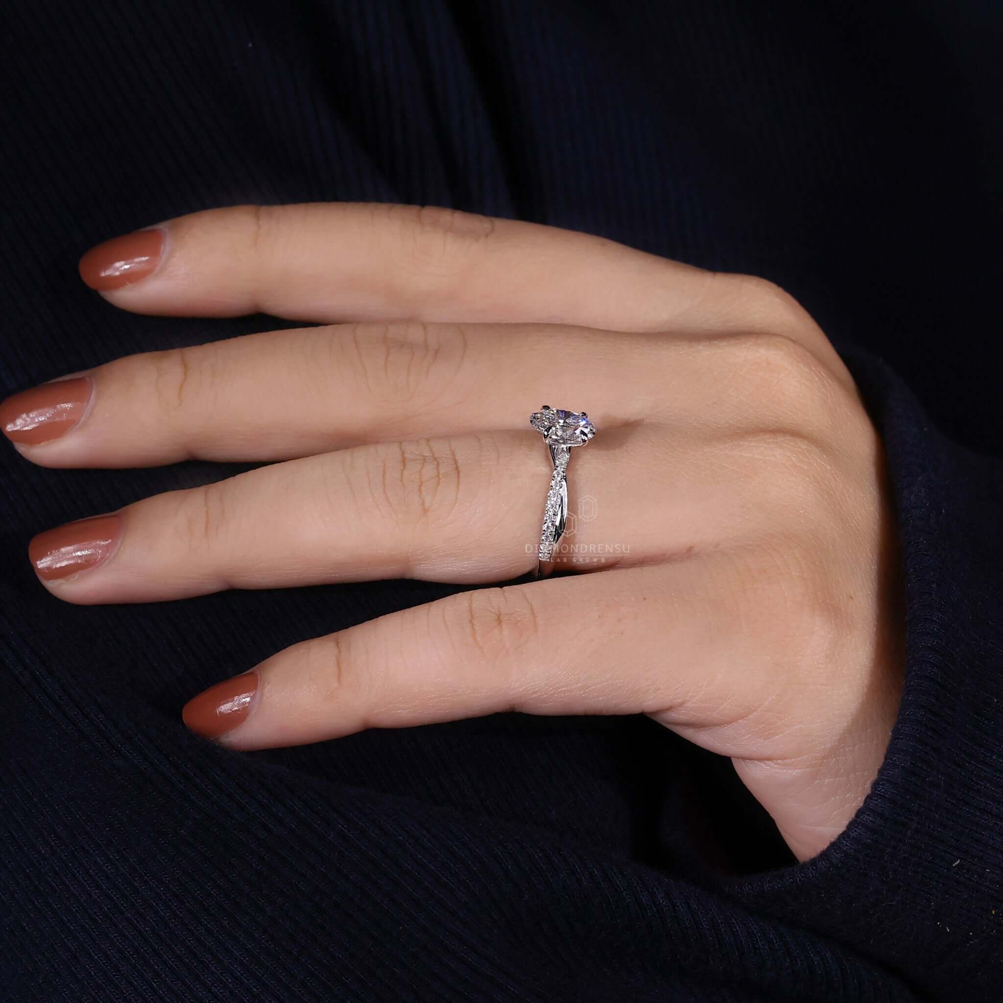 Twisted engagement ring with a 4 prong claw setting, featuring a Lab Grown Diamond for ethical and sustainable luxury.