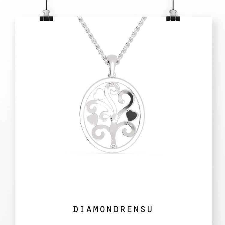 Handmade jewellery pendant in oval frame with tree of life.
