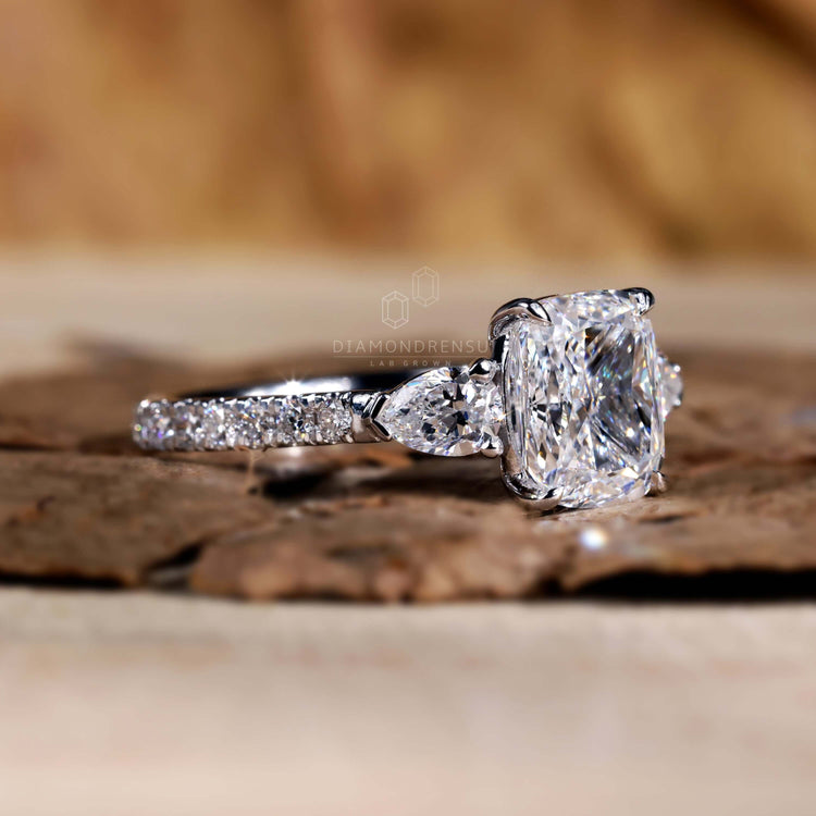 Cushion cut engagement ring featuring a pave band for sparkle
