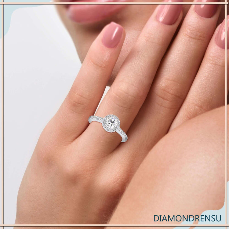 Elegant halo engagement ring featuring a cathedral setting ring style.
