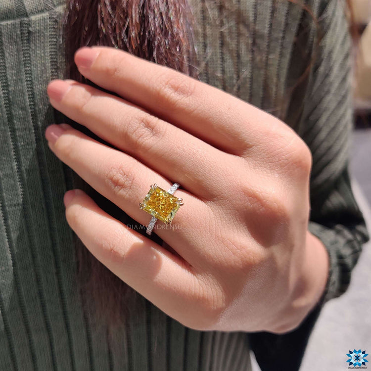 Round cut moissanite ring with hidden halo.
