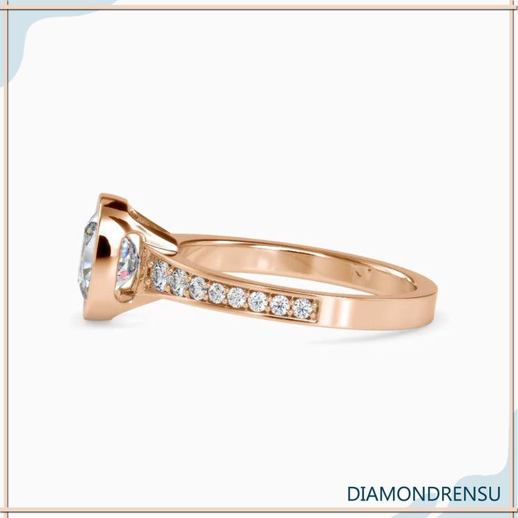 UK engagement ring with white gold and pave cushion design.
