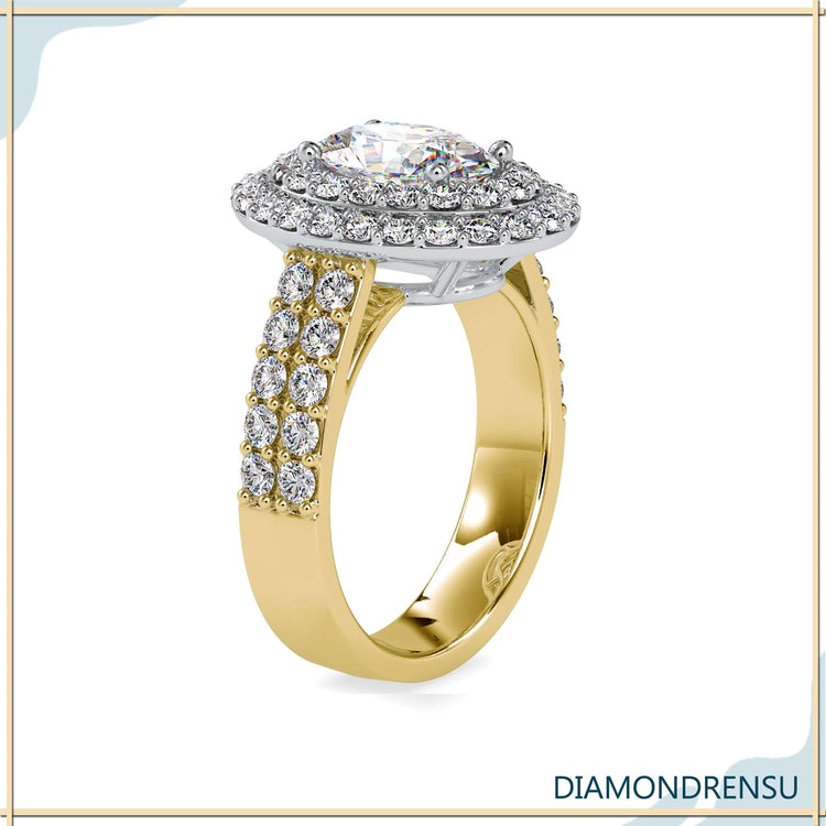 Round diamond side stones with oval cut double halo centre.
