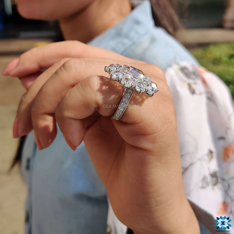 Buy moissanite ring with oval rose cut stone and halo setting.
