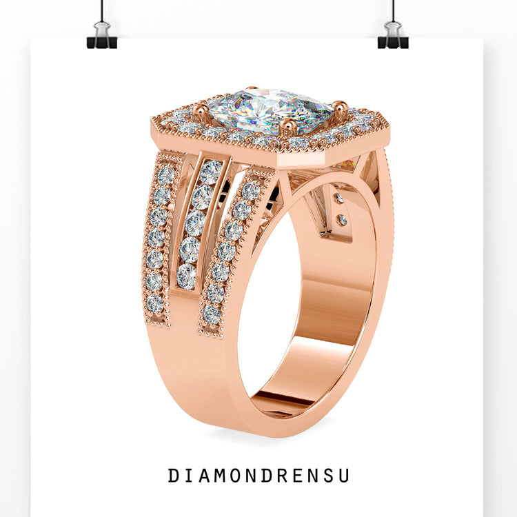 Halo engagement ring in white gold with handmade cushion centre.
