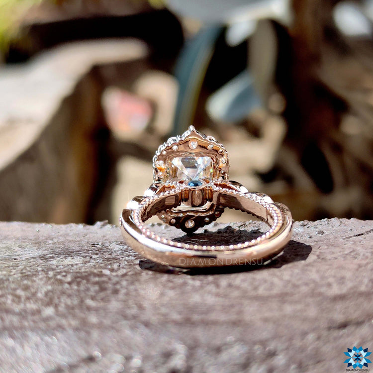 Double claw prong setting on emerald cut ring.
