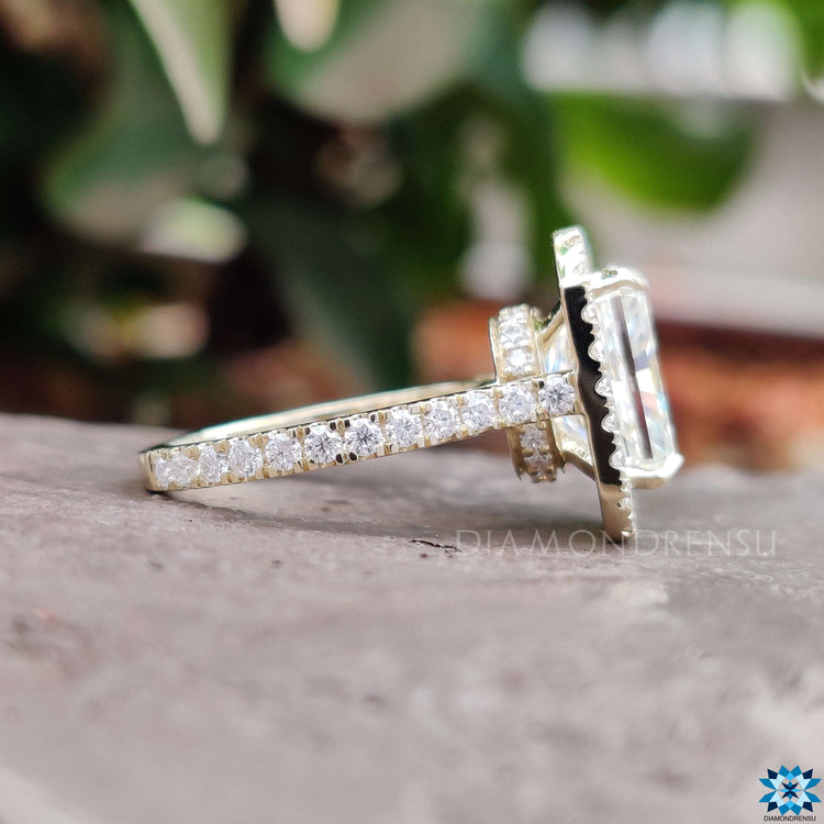Hidden halo moissanite engagement ring with radiant cut center stone.
