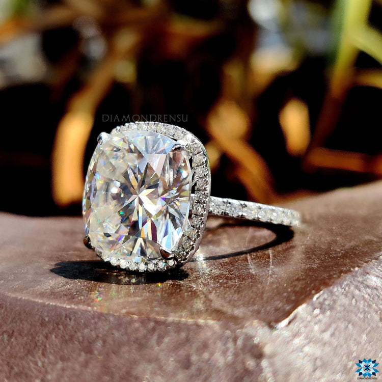 White gold engagement ring with cushion cut moissanite.
