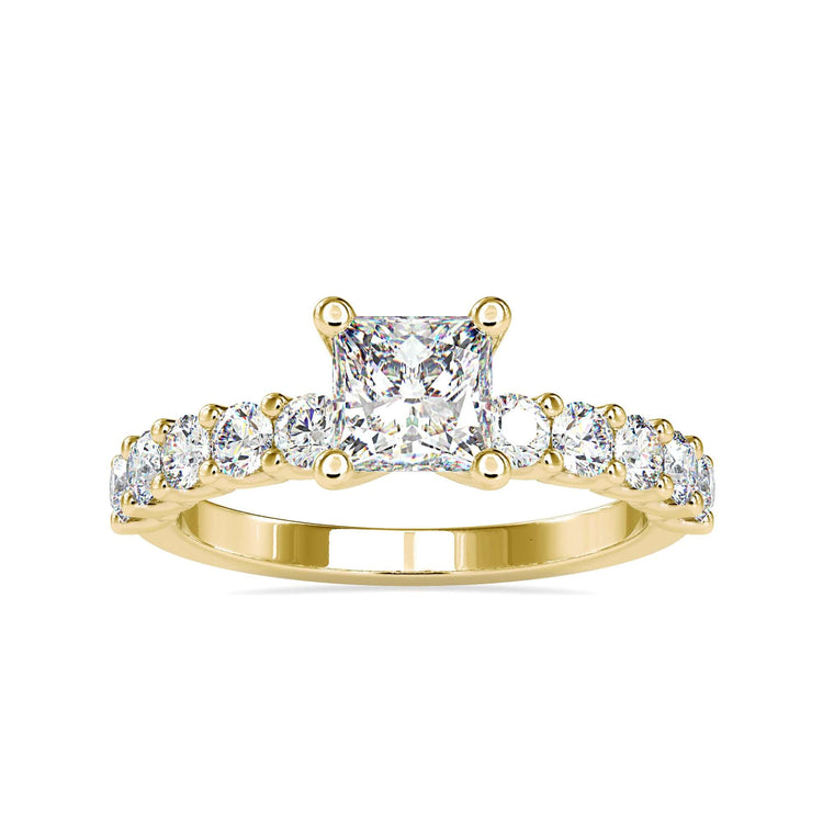 Simple diamond ring with princess cut centre and pave band.
