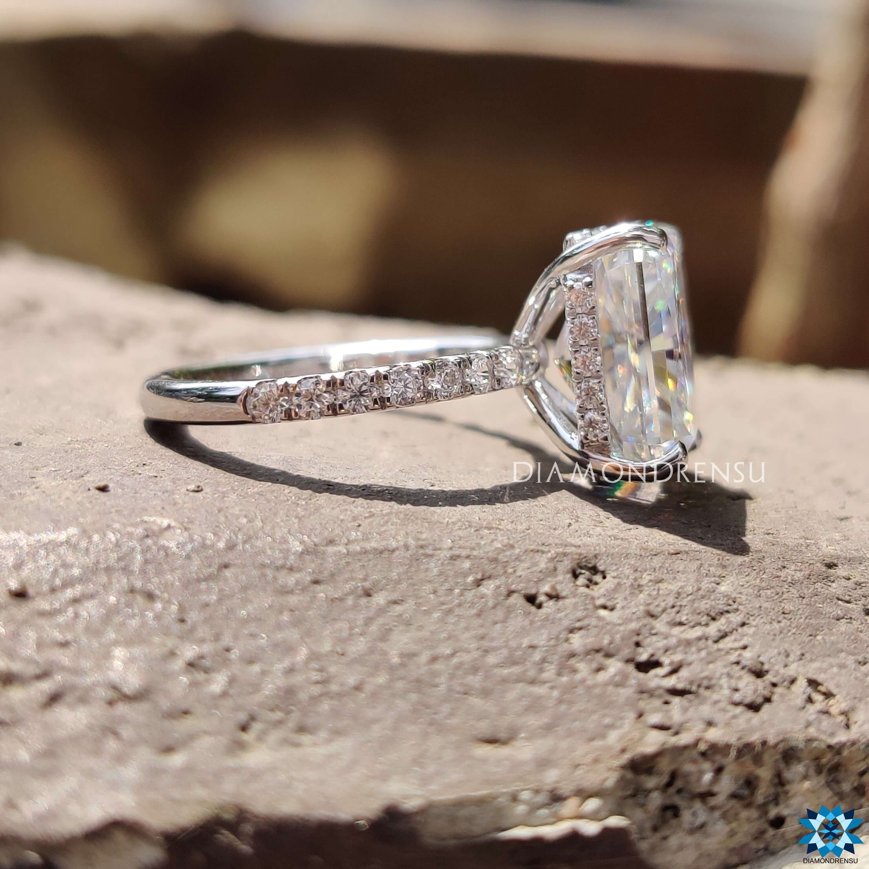 White gold engagement ring featuring a radiant cut and hidden halo.