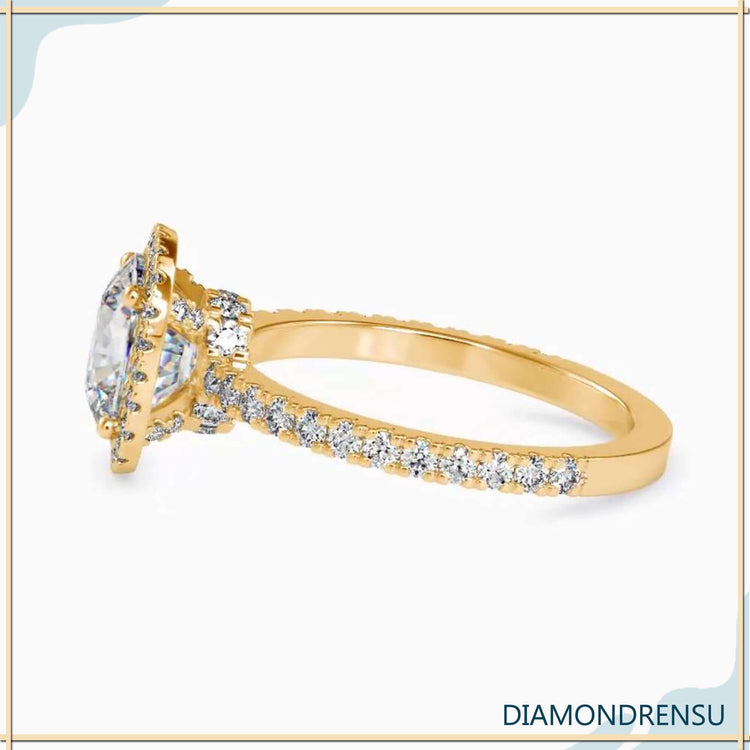 White gold ring with cushion cut and pave band.
