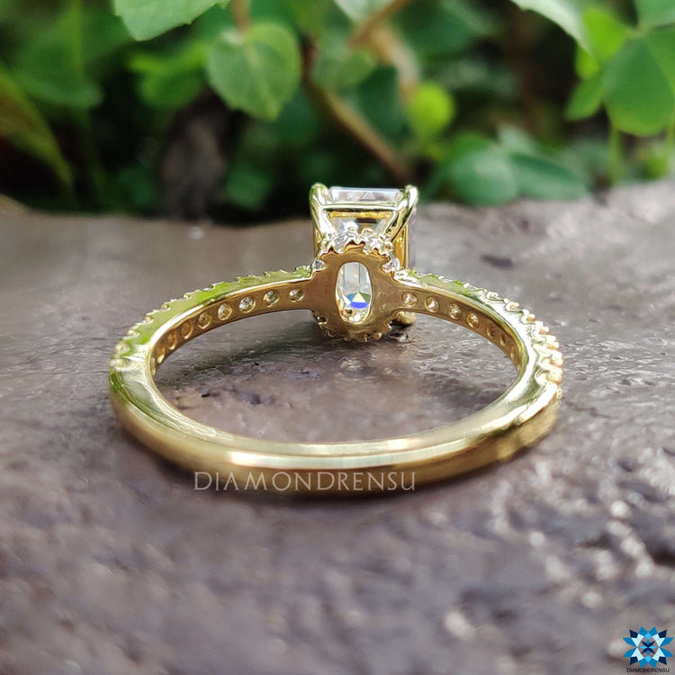 Handmade emerald cut moissanite ring with under halo setting.
