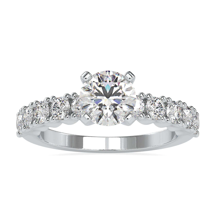 Simple diamond ring with round cut and pave band.
