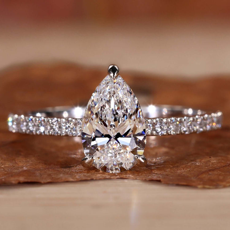Elegant pear halo engagement ring with sparkling details.