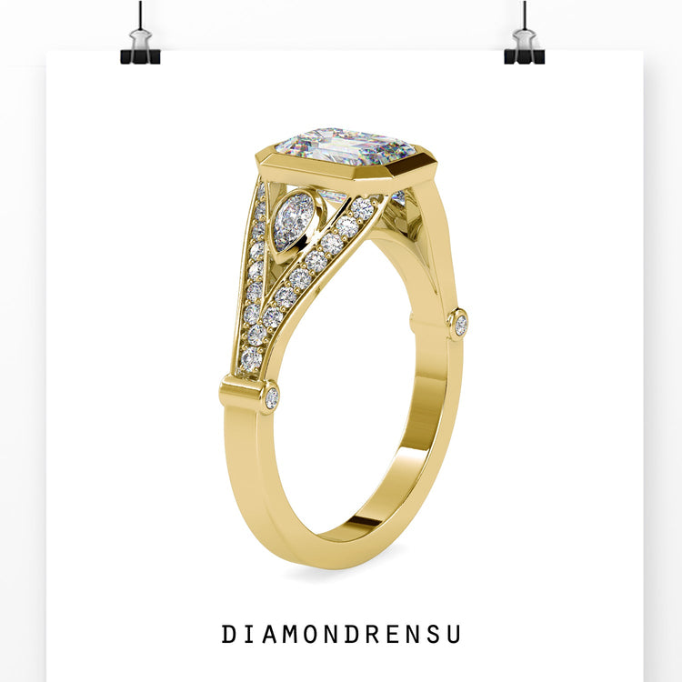 Buy diamond ring with pear side stones and split shank.

