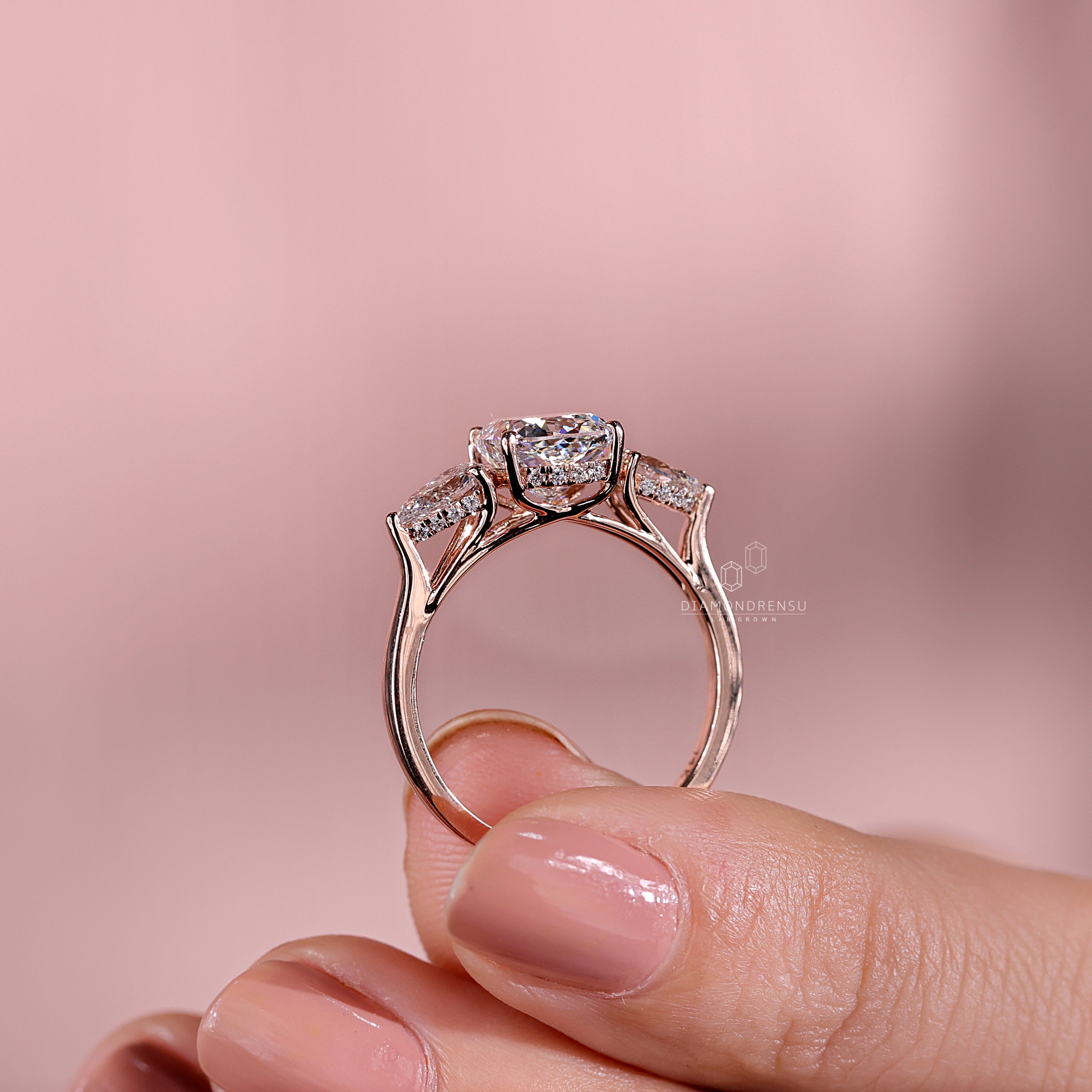 Stunning three stone diamond engagement ring design.