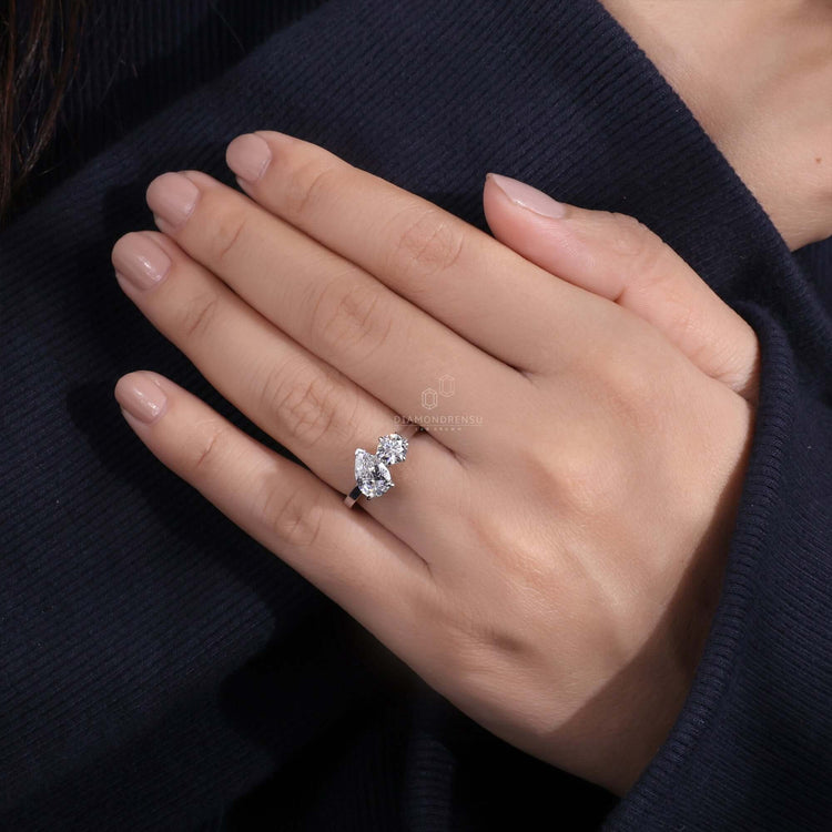 Claw prong setting engagement ring for women, designed with a cushion cut diamond for a unique and memorable proposal.
