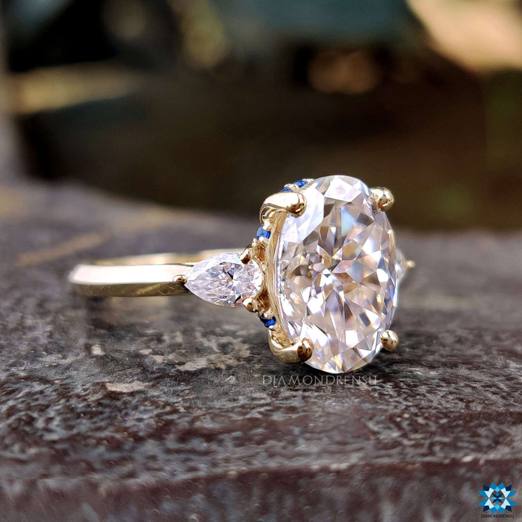 Yellow gold three stone moissanite ring.
