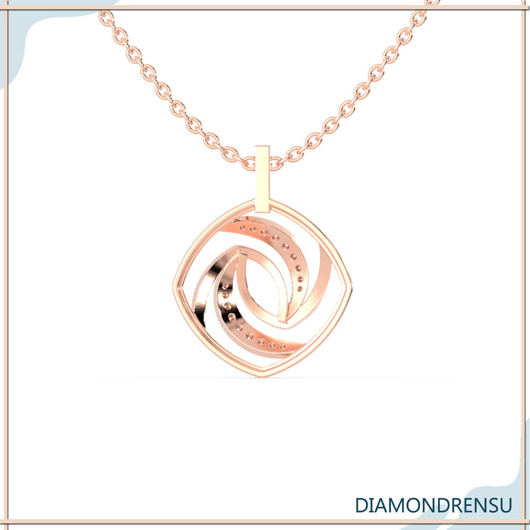 Gold diamond pendant in spiral form with round cut stone.
