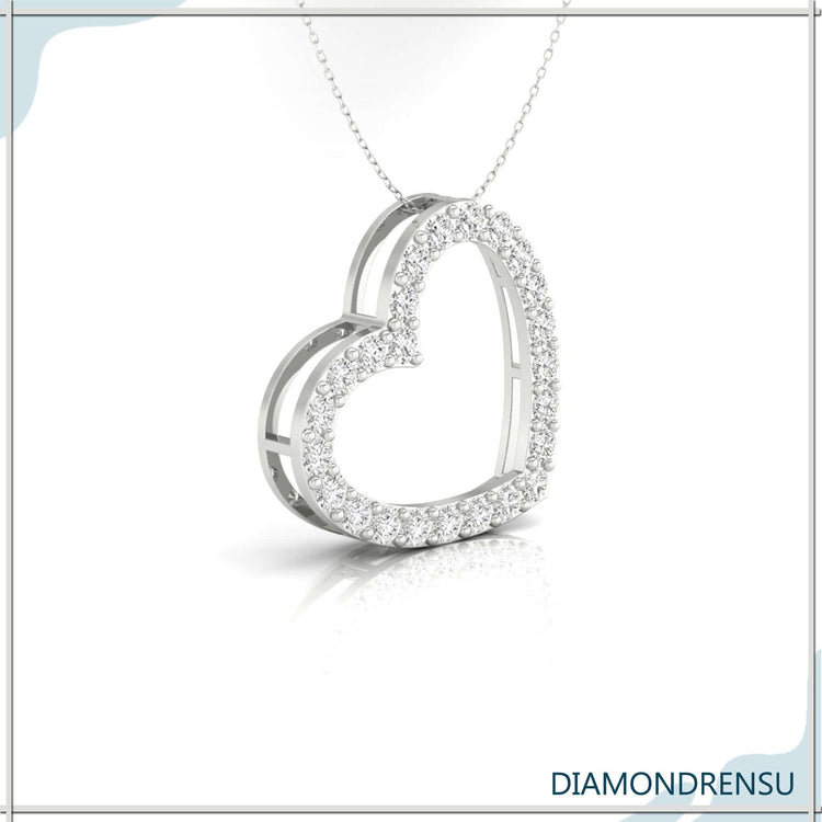 Handmade pendant featuring a round cut diamond in heart design.
