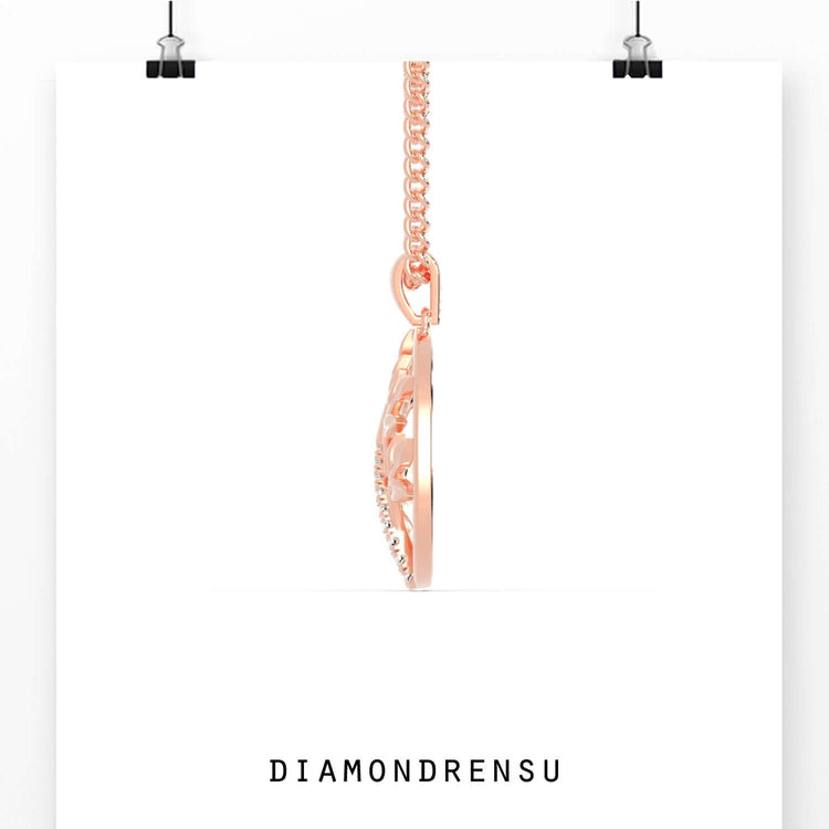 Gold diamond pendant featuring tree of life symbol and handmade finish.
