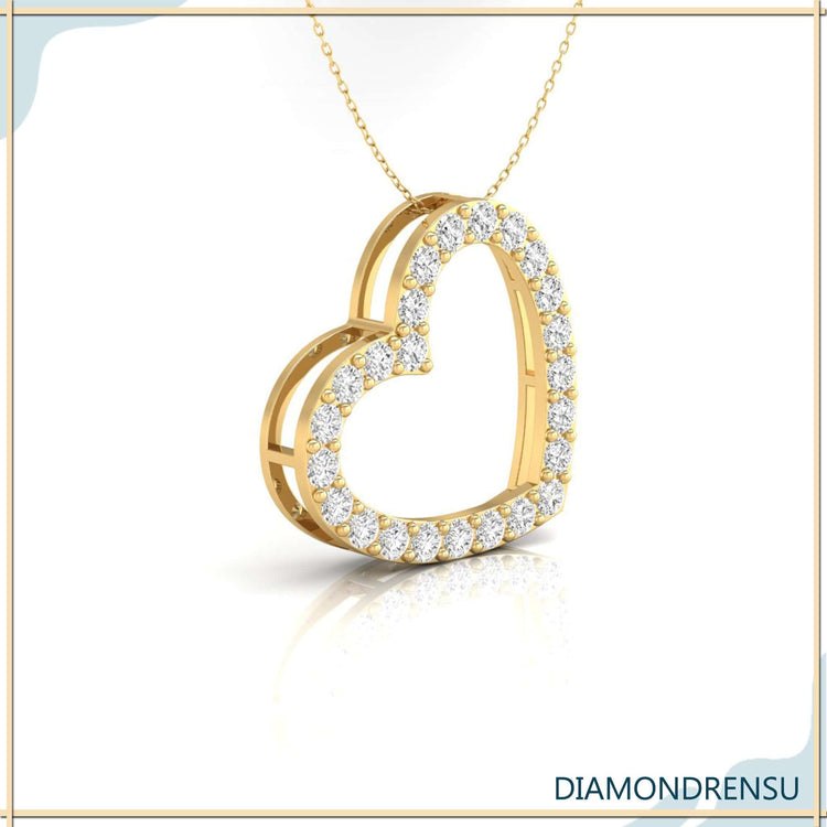 Unique diamond pendant with heart motif in yellow gold.
