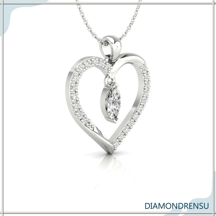 Handmade pendant featuring heart outline and marquise diamond.
