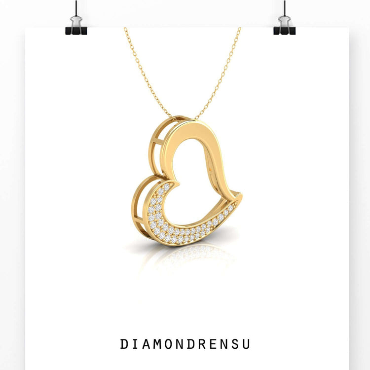 Elegant heart pendant with lab grown diamond detailing.
