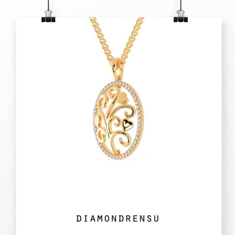 Gold diamond pendant featuring oval tree life silhouette.
