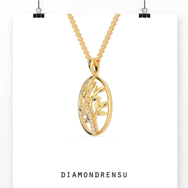 Tree of life pendant gold design with lab grown diamond accent.
