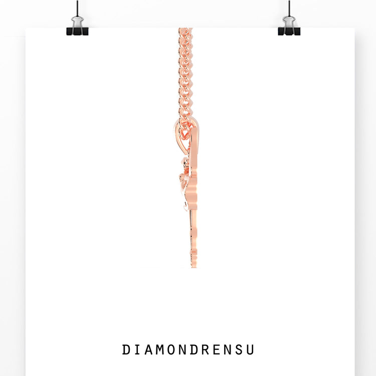 Diamondrensu UK pendant showcasing a gold angel design.
