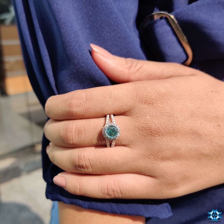 Moissanite ring with round pave accents.
