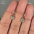Bezel set diamond earrings in yellow gold.