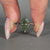 Green Dutch marquise diamond ring with solitaire setting.