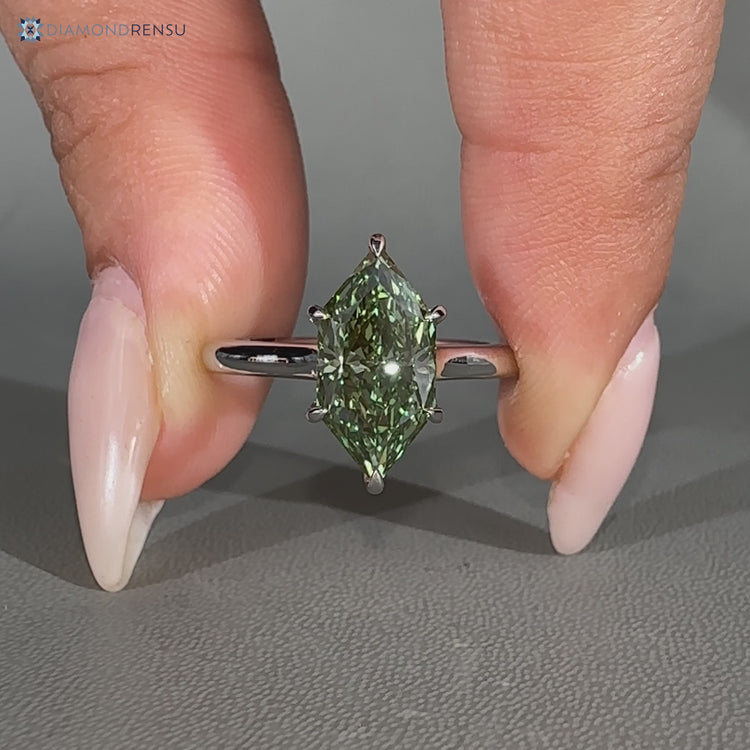 Green Dutch marquise diamond ring with solitaire setting.