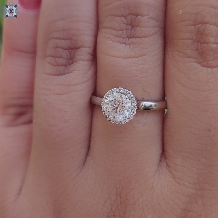 Custom moissanite ring in a round cut halo setting.
