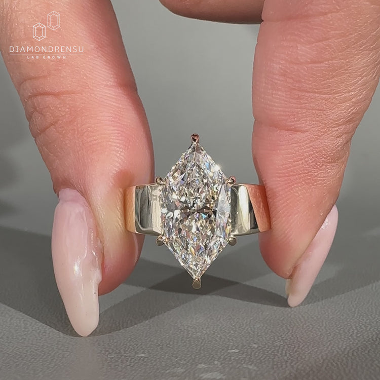 Handmade marquise ring with wide band and basket setting