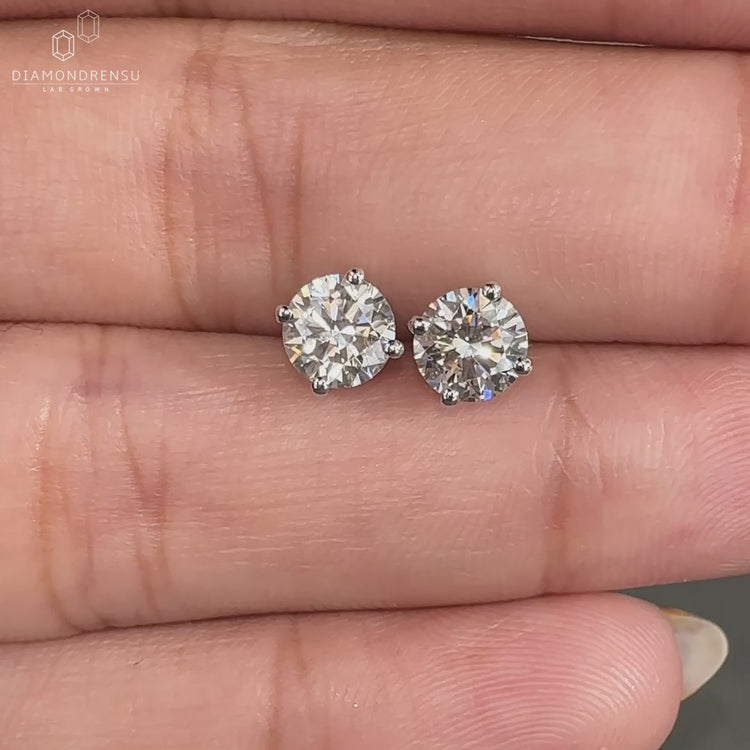 Round cut diamond earrings for women.
