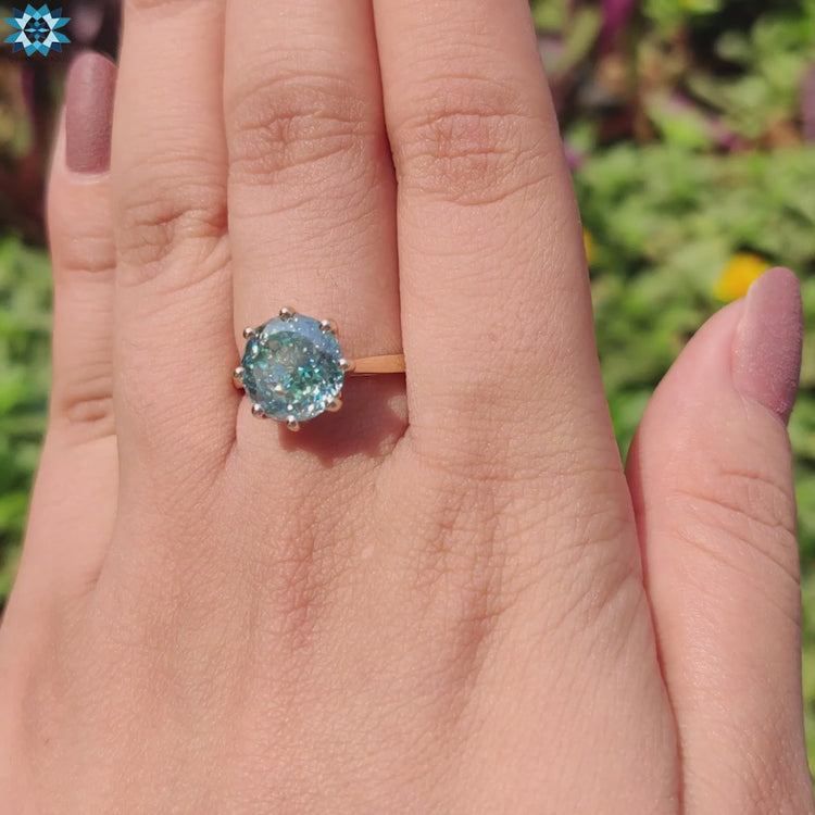 Yellow gold ring with Portuguese cut center stone.

