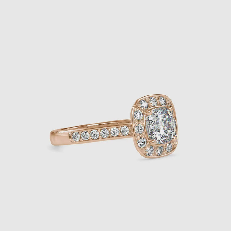 Lab grown cushion cut diamond ring in round cut halo mount.
