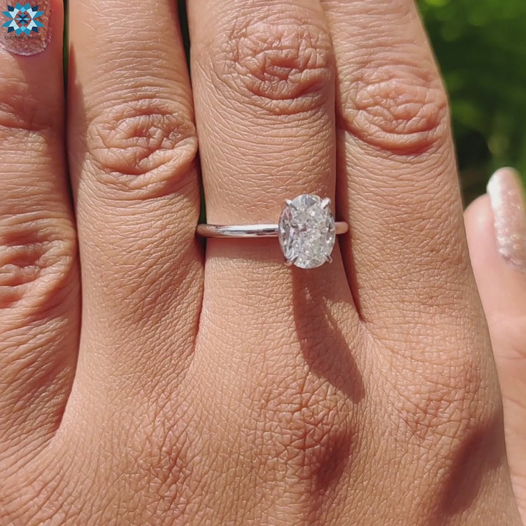 Handmade jewelry with oval moissanite solitaire.

