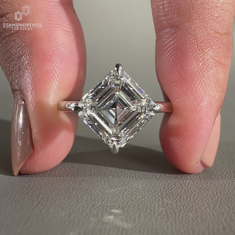 This asscher cut ring includes a 4 prong ring with compass prong ring setting.
