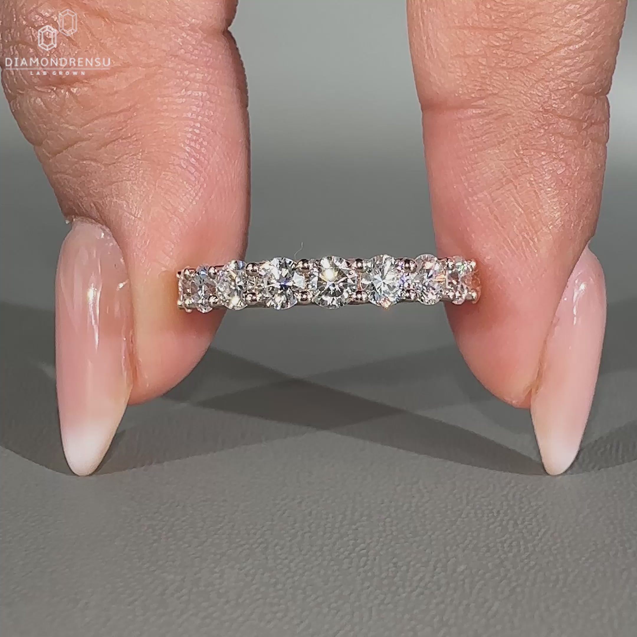 Round diamond wedding band in rose gold
